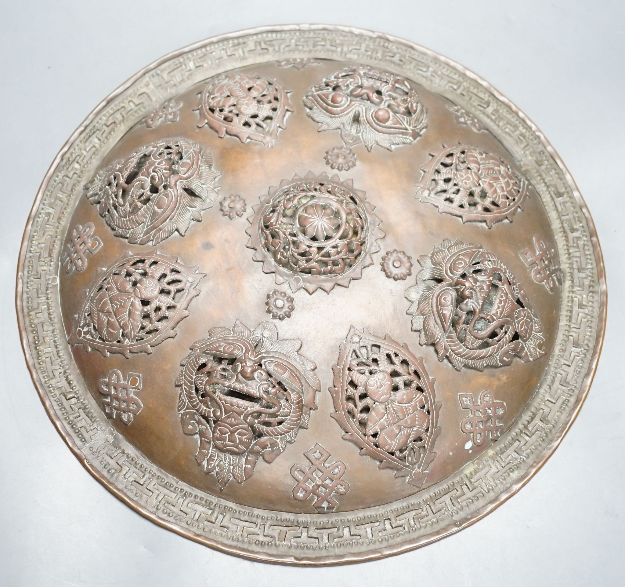 A Persian circular copper shield, 35.5 cms diameter.